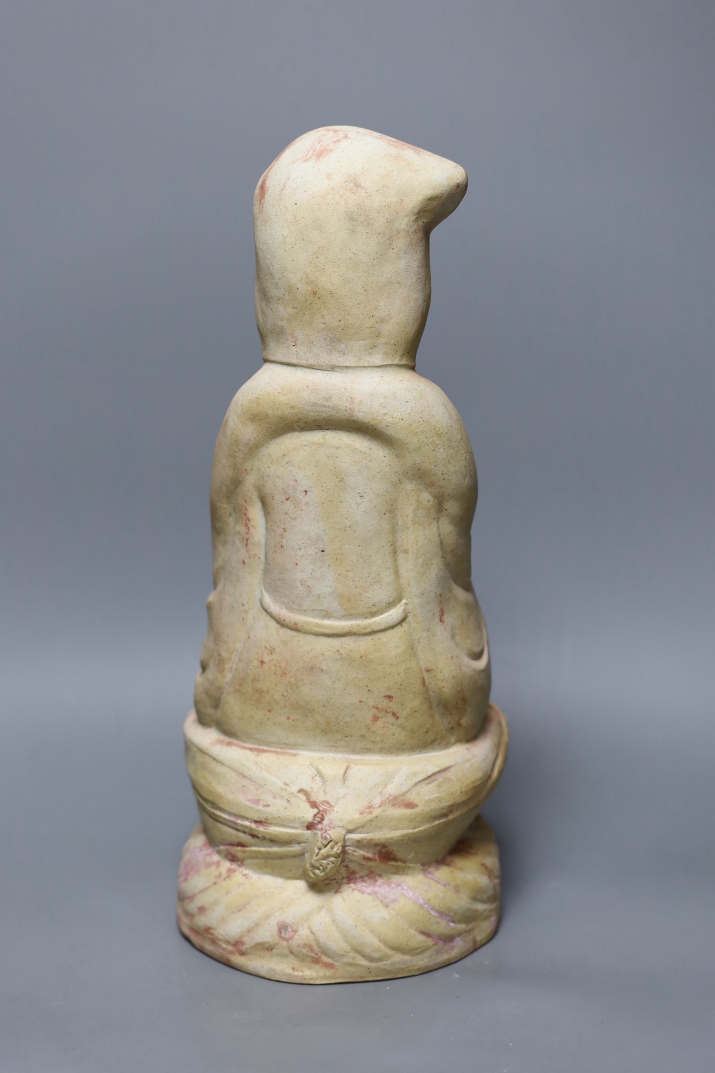 A Chinese biscuit figure of Guanyin, 38 cms high